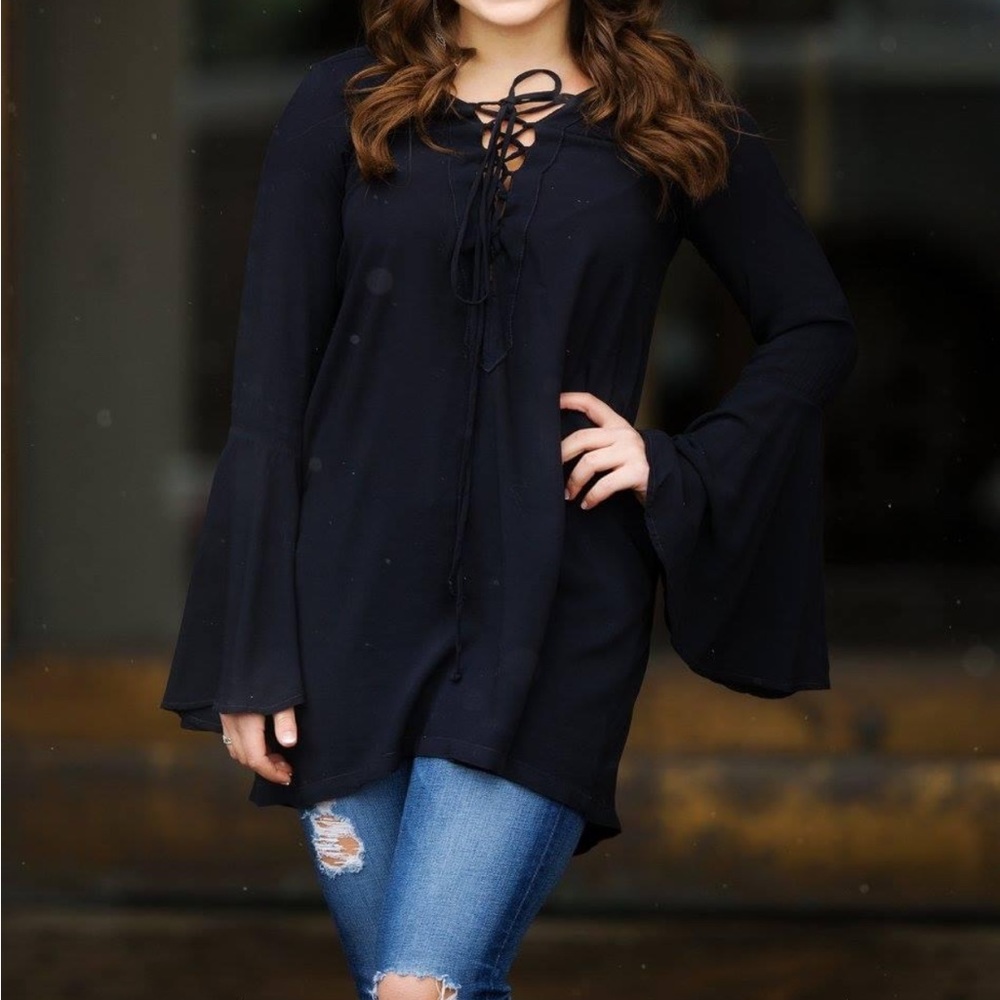 Black blouse with flowy sleeves and lace up detail
